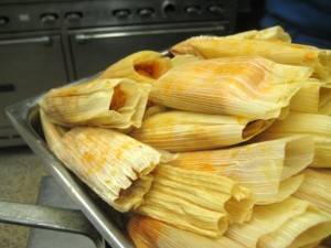 The finished pork tamales. The masa has turned red from being mixed with salsa roja.
