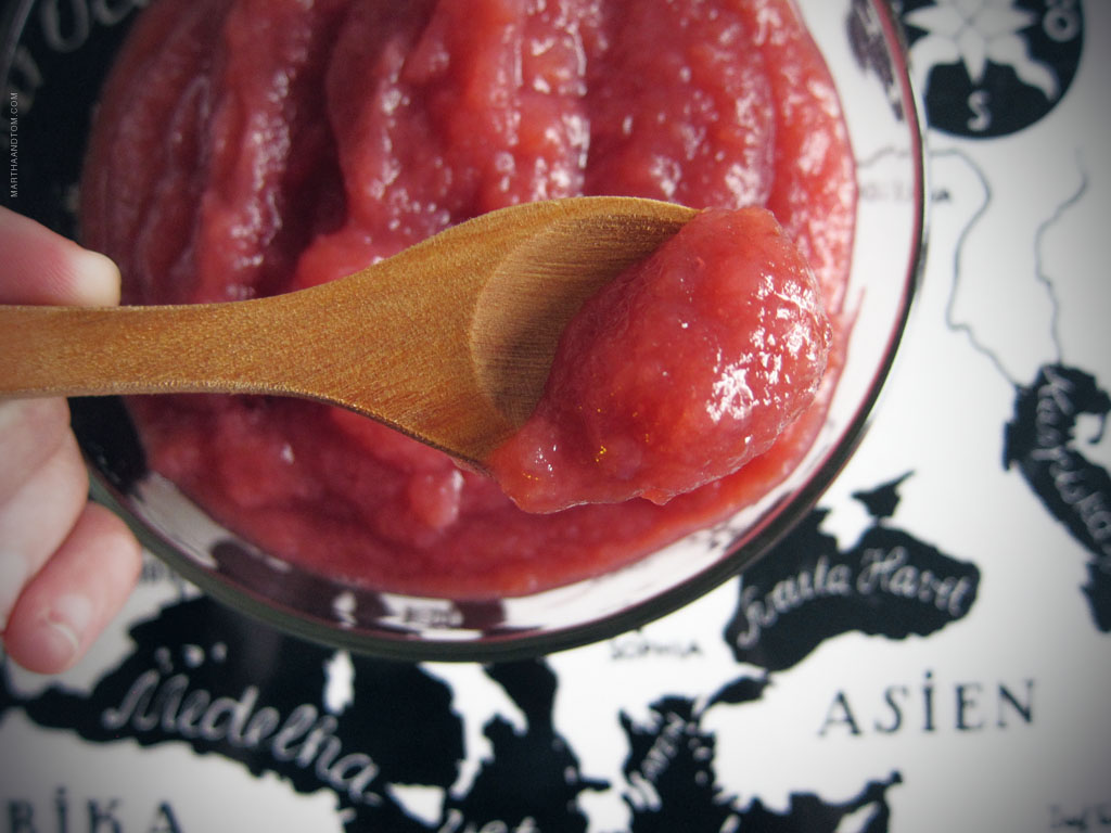 Apple Sauce Homemade applesauce pictured in a bowl with a wooden spoon