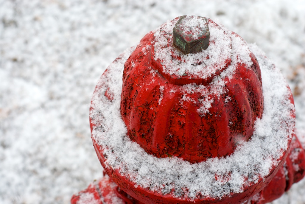 Fresh snow on a fire hydrant
